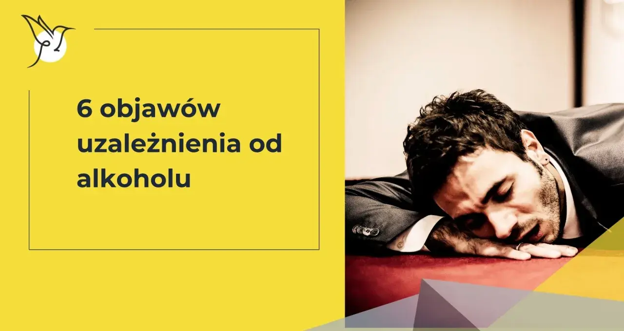 6 objawów uzależnienia od alkoholu. Mężczyzna w garniturze śpi na stole, wyczerpany.