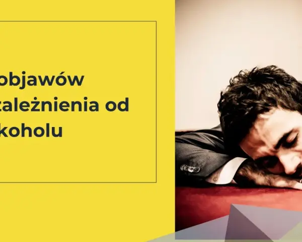 6 objawów uzależnienia od alkoholu. Mężczyzna w garniturze śpi na stole, wyczerpany.